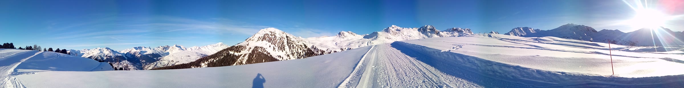 Panoramic view across the snowy mountains and pistes around La Plagne